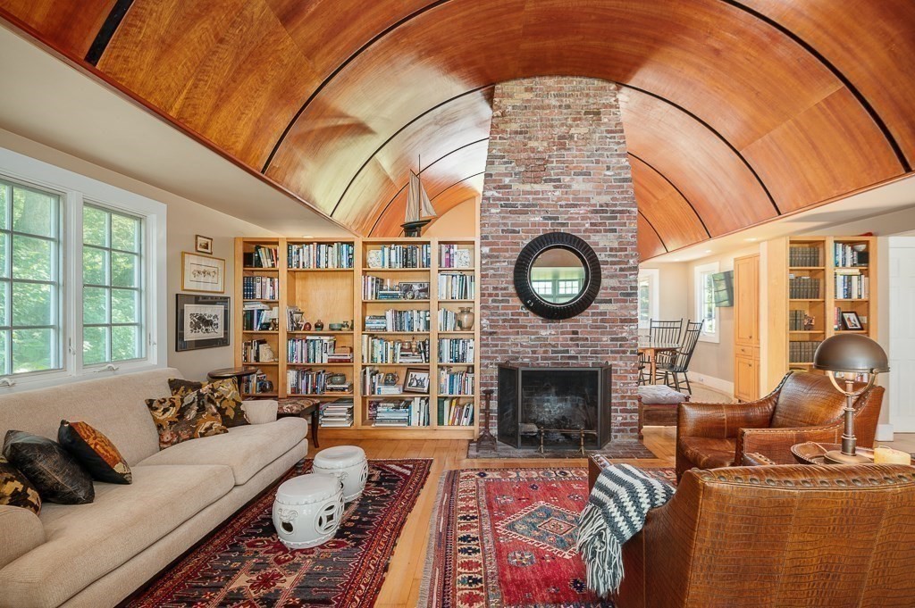 172 Argilla Road Ipswich, MA 01938 - Photo 17 of 34 a living room with furniture a fireplace and a large window