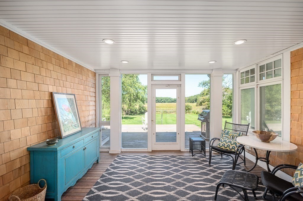 172 Argilla Road Ipswich, MA 01938 - Photo 22 of 34 a living room with furniture and large windows