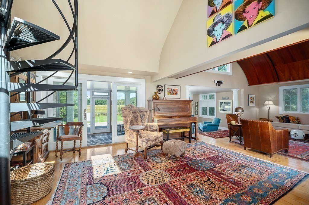 172 Argilla Road Ipswich, MA 01938 - Photo 25 of 34 a living room filled with furniture and a rug