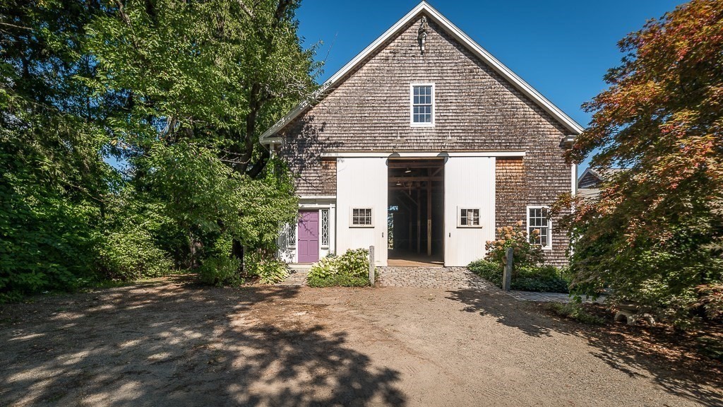172 Argilla Road Ipswich, MA 01938 - Photo 5 of 34 a front view of a house with a yard and garage