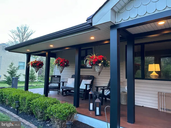 a group of people sitting in front of a building