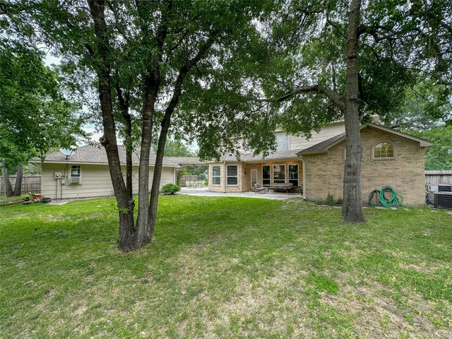 a view of a house with a big yard