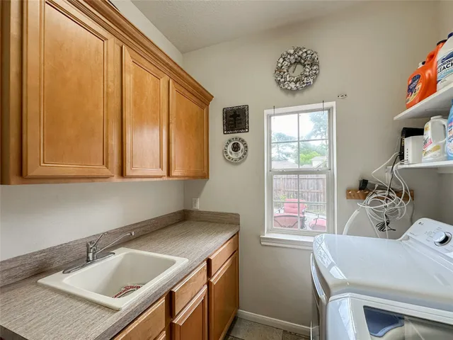 a bathroom with a sink and a window