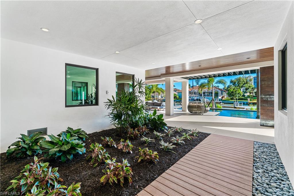 448 Oak Avenue Naples, FL 34108 - Photo 12 of 49 Foyer with elevator access and custom staircase