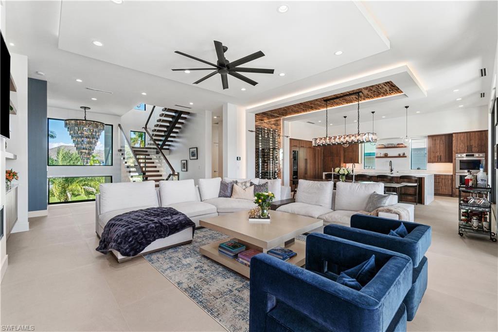 448 Oak Avenue Naples, FL 34108 - Photo 16 of 49 Stairs with a towering ceiling