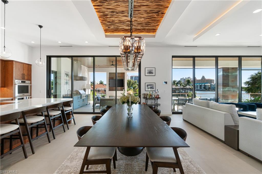 448 Oak Avenue Naples, FL 34108 - Photo 19 of 49 Tiled dining room featuring sink and wood ceiling