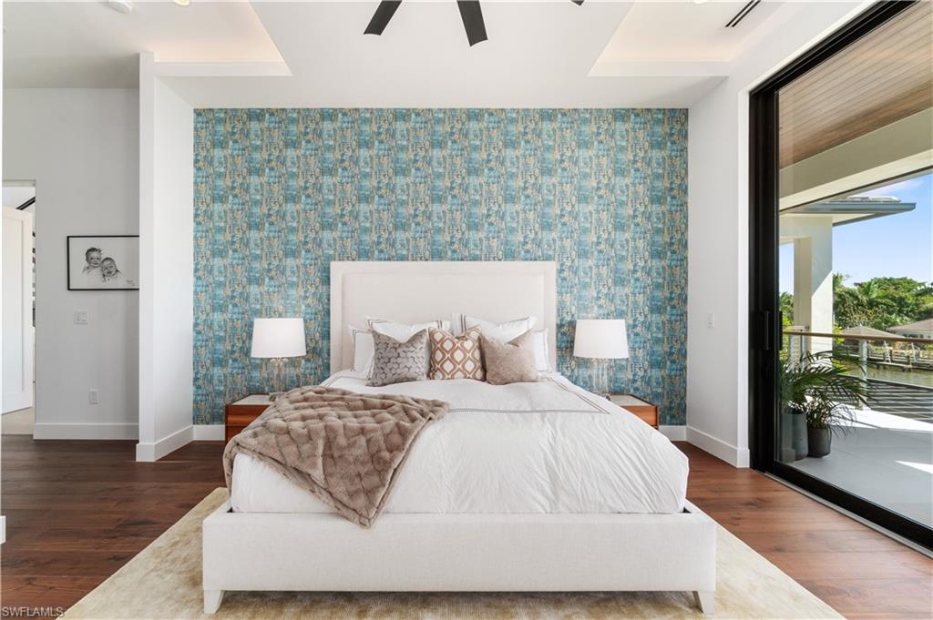 448 Oak Avenue Naples, FL 34108 - Photo 26 of 49 Balcony at dusk with a water view