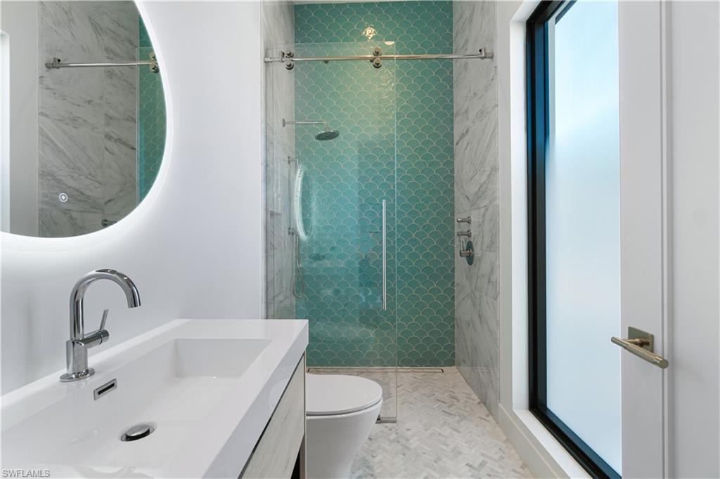 448 Oak Avenue Naples, FL 34108 - Photo 34 of 49 Bedroom featuring dark wood-type flooring