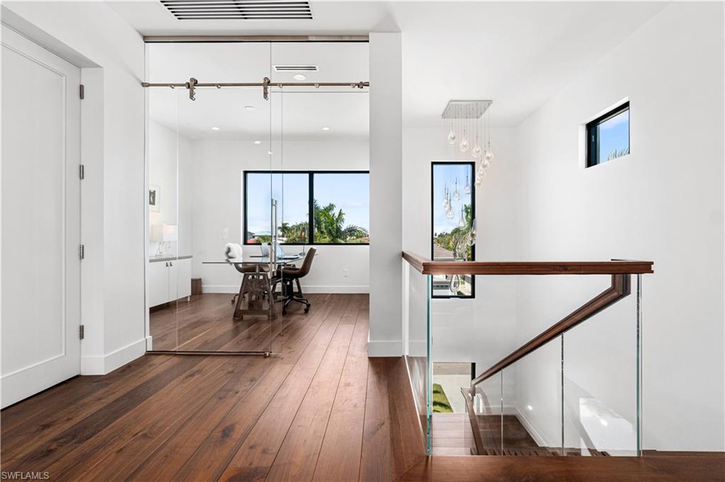 448 Oak Avenue Naples, FL 34108 - Photo 35 of 49 Bathroom with an enclosed shower, vanity, and toilet