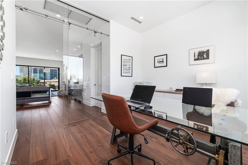 448 Oak Avenue Naples, FL 34108 - Photo 36 of 49 Corridor with dark hardwood / wood-style floors