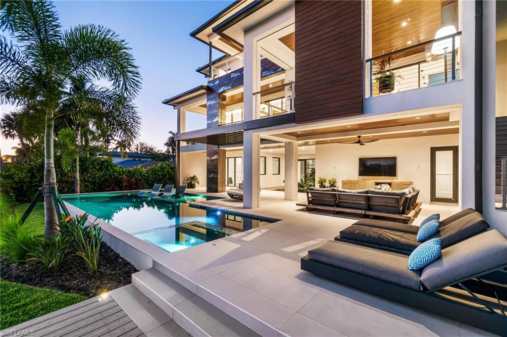 448 Oak Avenue Naples, FL 34108 - Photo 4 of 49 View of swimming pool featuring a patio