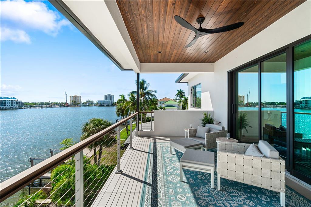 448 Oak Avenue Naples, FL 34108 - Photo 41 of 49 Balcony with ceiling fan, outdoor lounge area, and a water view