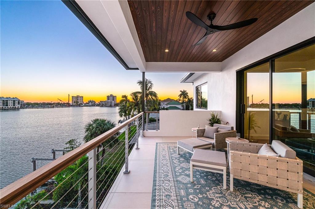 448 Oak Avenue Naples, FL 34108 - Photo 42 of 49 Balcony with ceiling fan and a water view