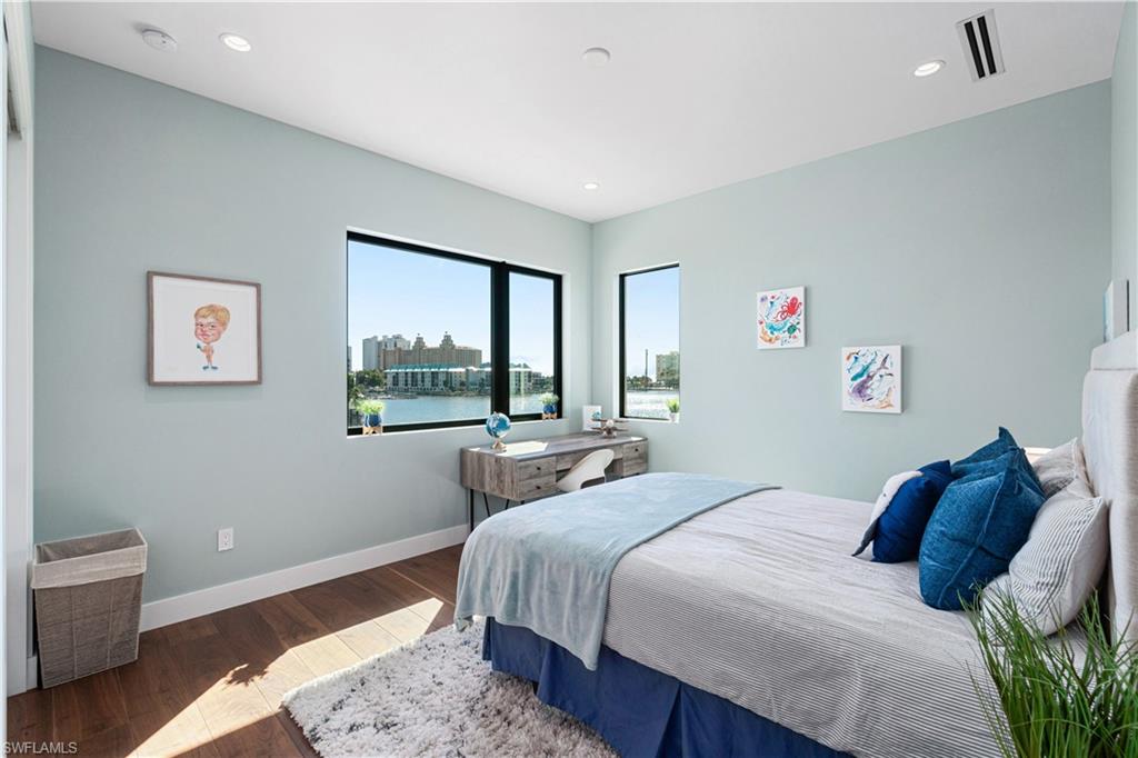 448 Oak Avenue Naples, FL 34108 - Photo 43 of 49 Balcony at dusk featuring a water view and ceiling fan