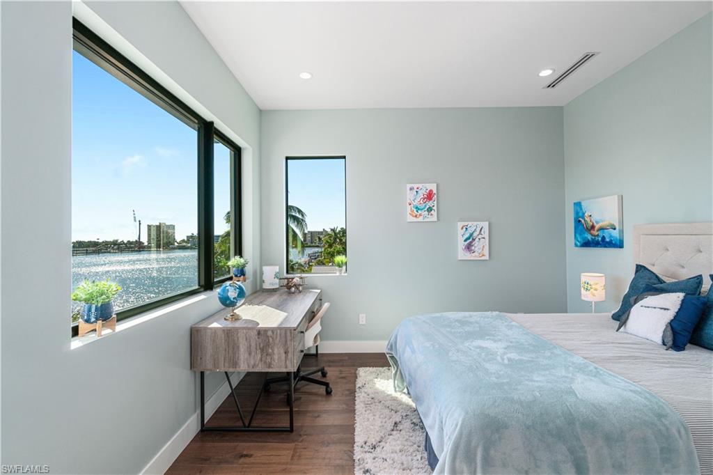 448 Oak Avenue Naples, FL 34108 - Photo 44 of 49 Bedroom featuring dark hardwood / wood-style floors