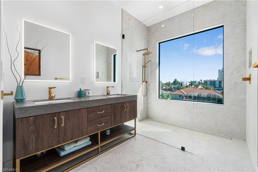 448 Oak Avenue Naples, FL 34108 - Photo 48 of 49 Bedroom with dark hardwood / wood-style flooring and a raised ceiling