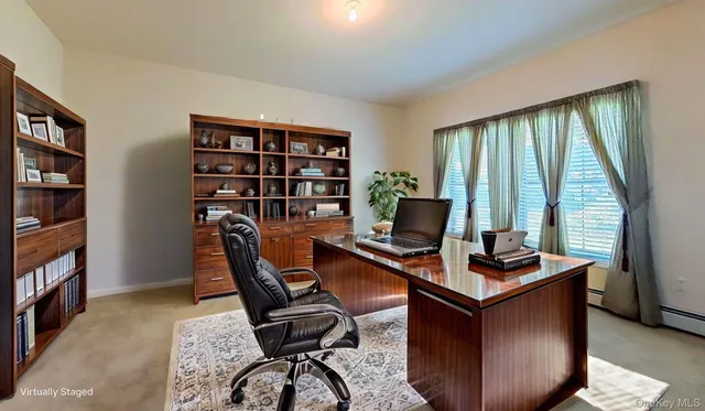 a view of hallway with wooden floor