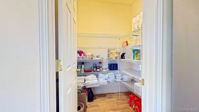 a spacious bedroom with a large bed and a dresser