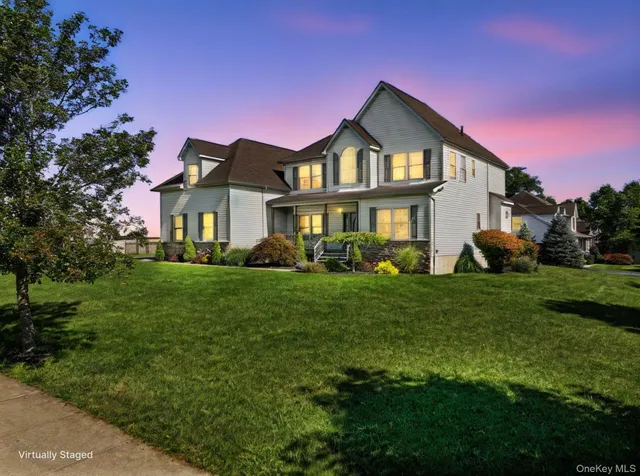 an aerial view of a house with swimming pool garden and patio