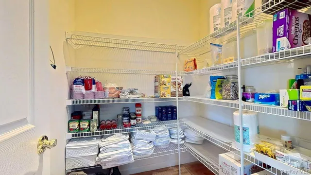 a bathroom with a granite countertop sink a toilet and a mirror