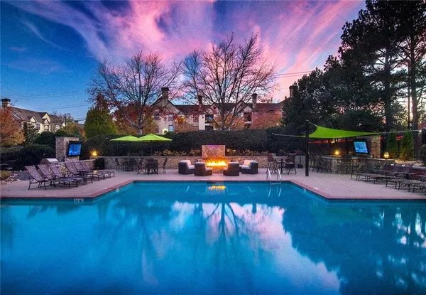 a view of a patio with a table and chairs