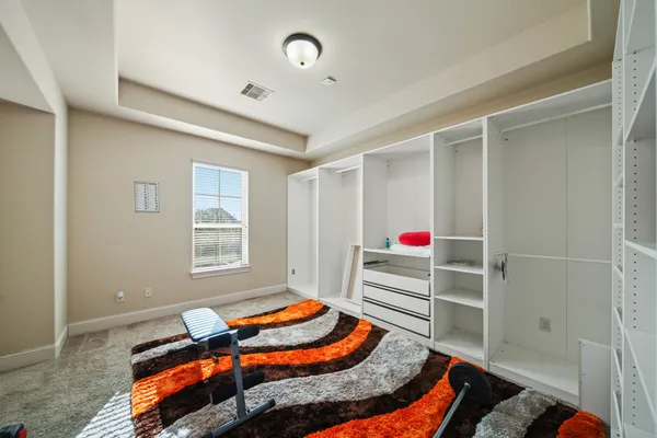 a bedroom with furniture and a window