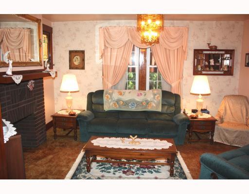 4044 Franklin Road Observatory Hill, PA 15214 - Photo 4 of 16 Living Room. Graceful living room features gas fireplace and 2 stained glass windows.