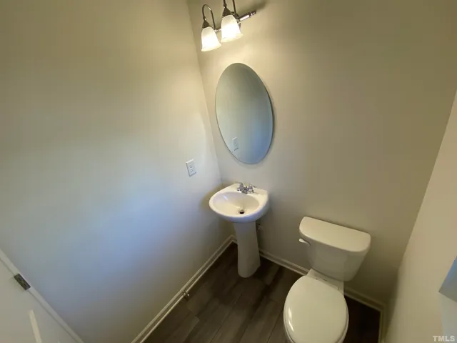 a bathroom with a toilet and a sink