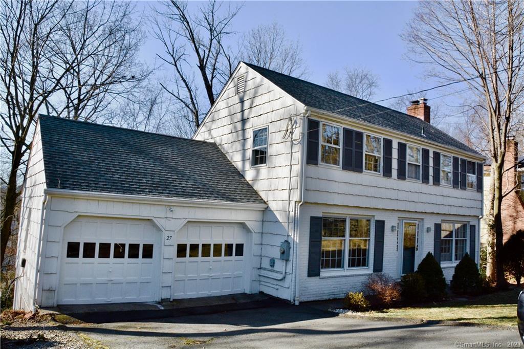 a view of a white building among the street