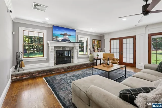 a living room with furniture and a fireplace