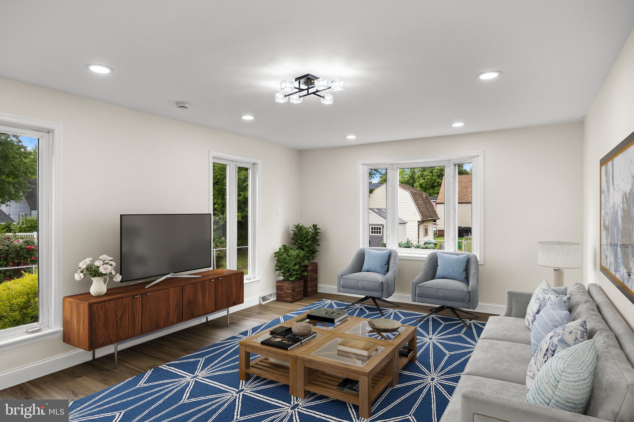 937 Clements Bridge Road Barrington, NJ 08007 - Photo 23 of 34 a living room with furniture and a flat screen tv