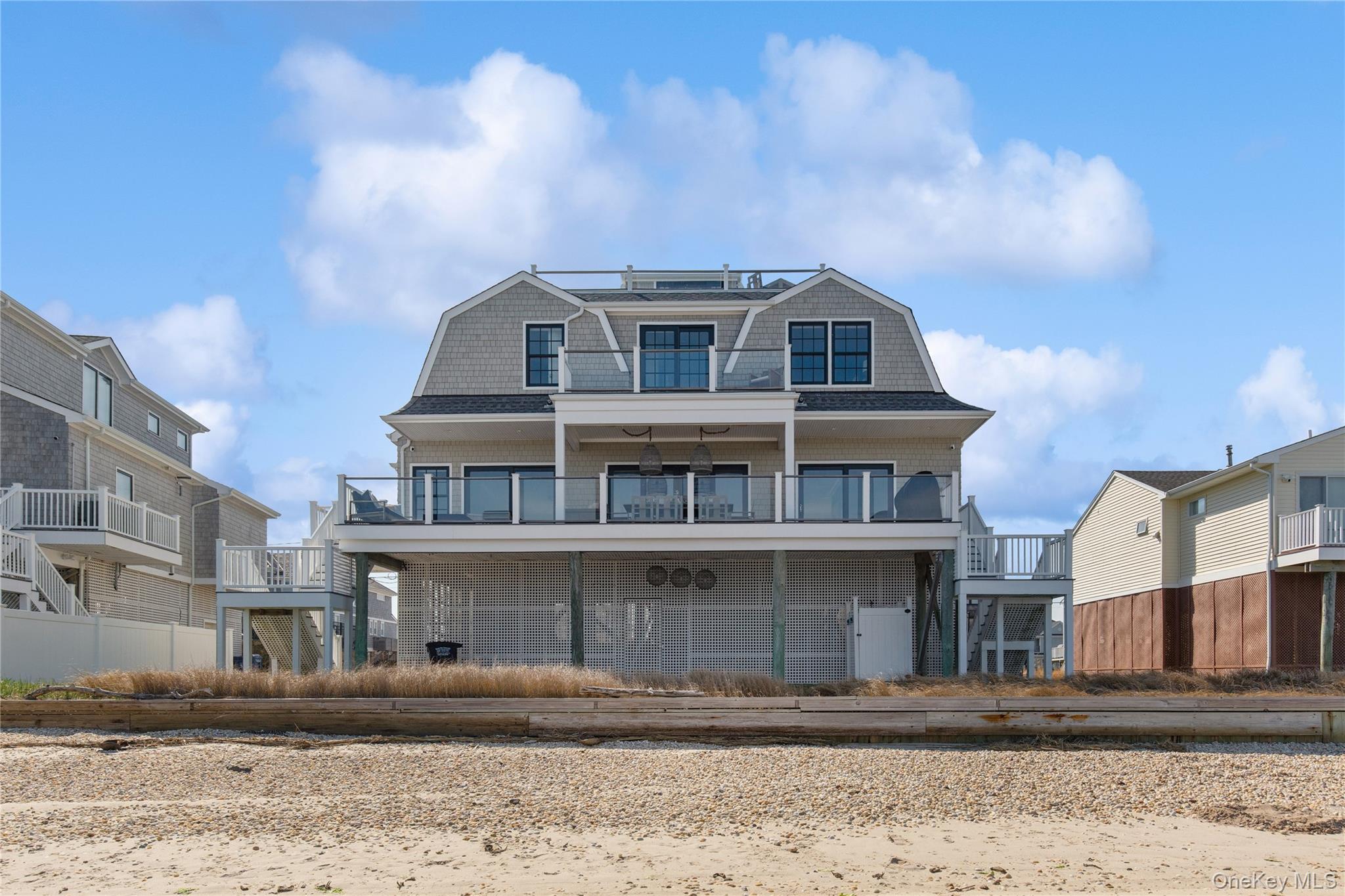 39 Shinnecock Road East Quogue, NY 11942 - Photo 1 of 35 a front view of a house