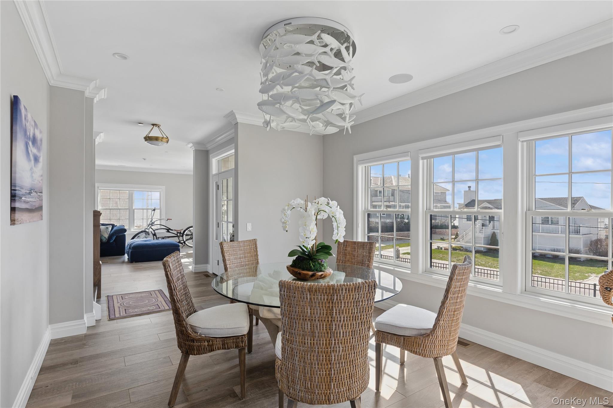 39 Shinnecock Road East Quogue, NY 11942 - Photo 11 of 35 a living room with furniture and a large window