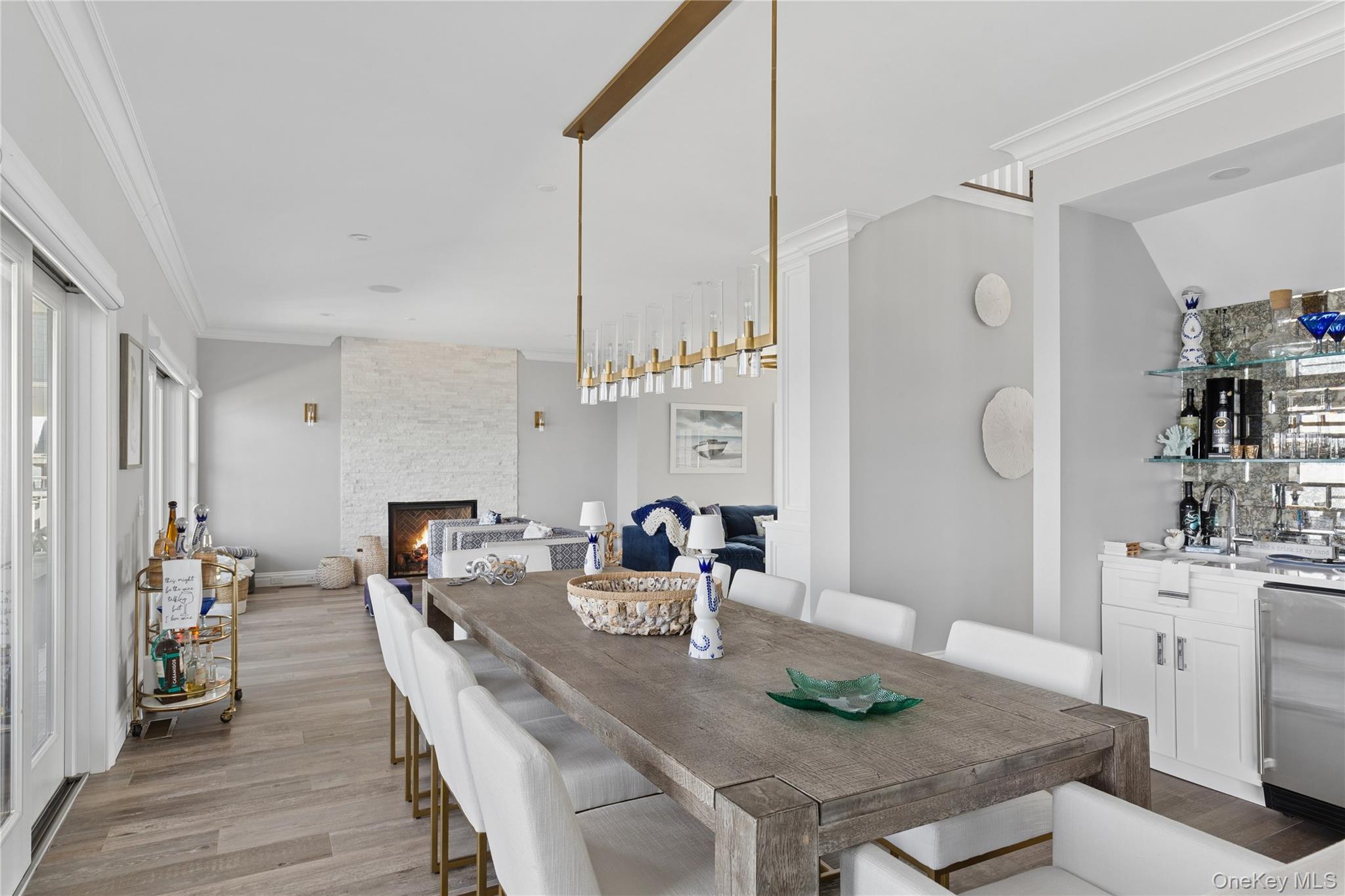 39 Shinnecock Road East Quogue, NY 11942 - Photo 17 of 35 a view of a dining room with furniture and wooden floor