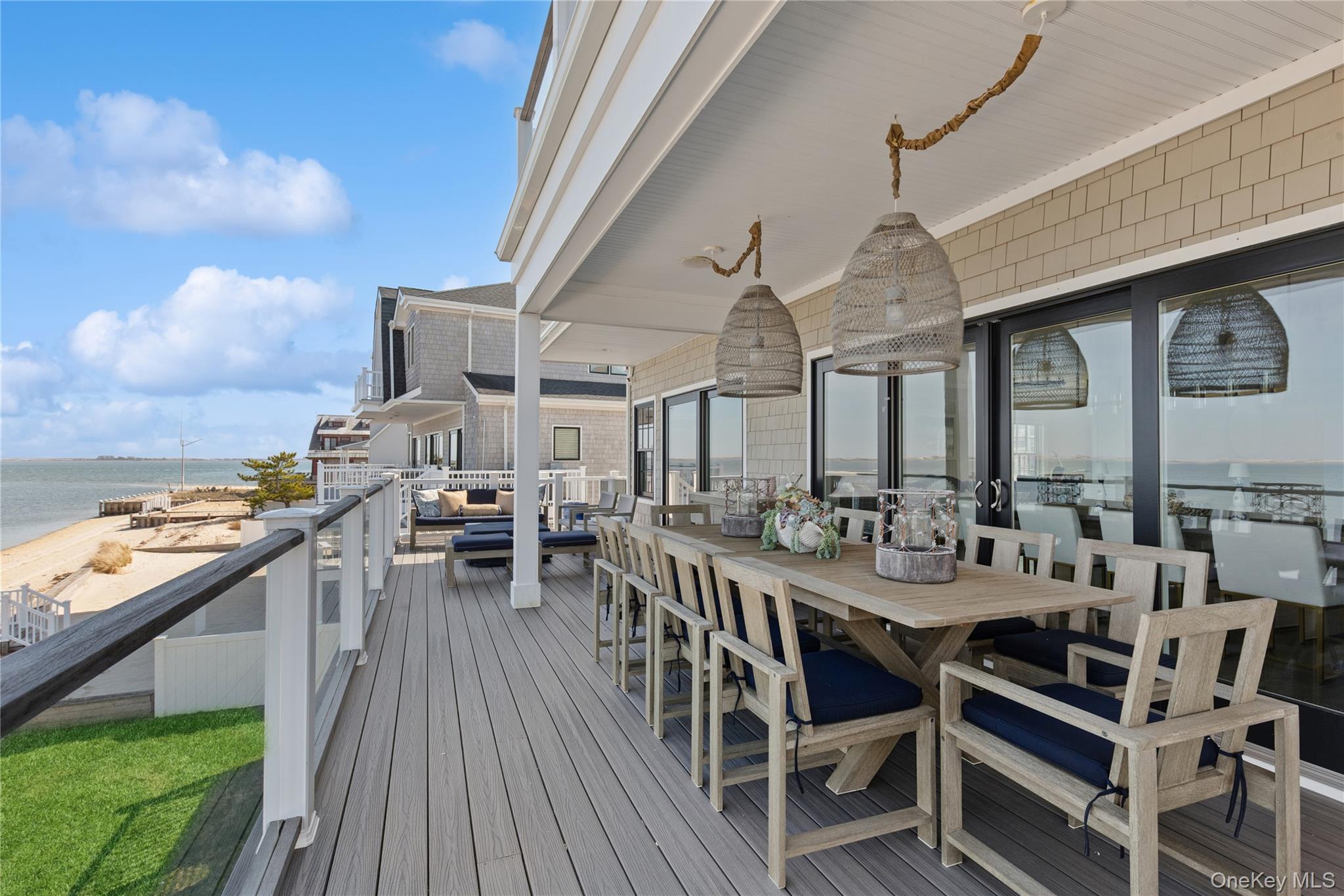 39 Shinnecock Road East Quogue, NY 11942 - Photo 20 of 35 a view of a dining tables and chairs in the balcony