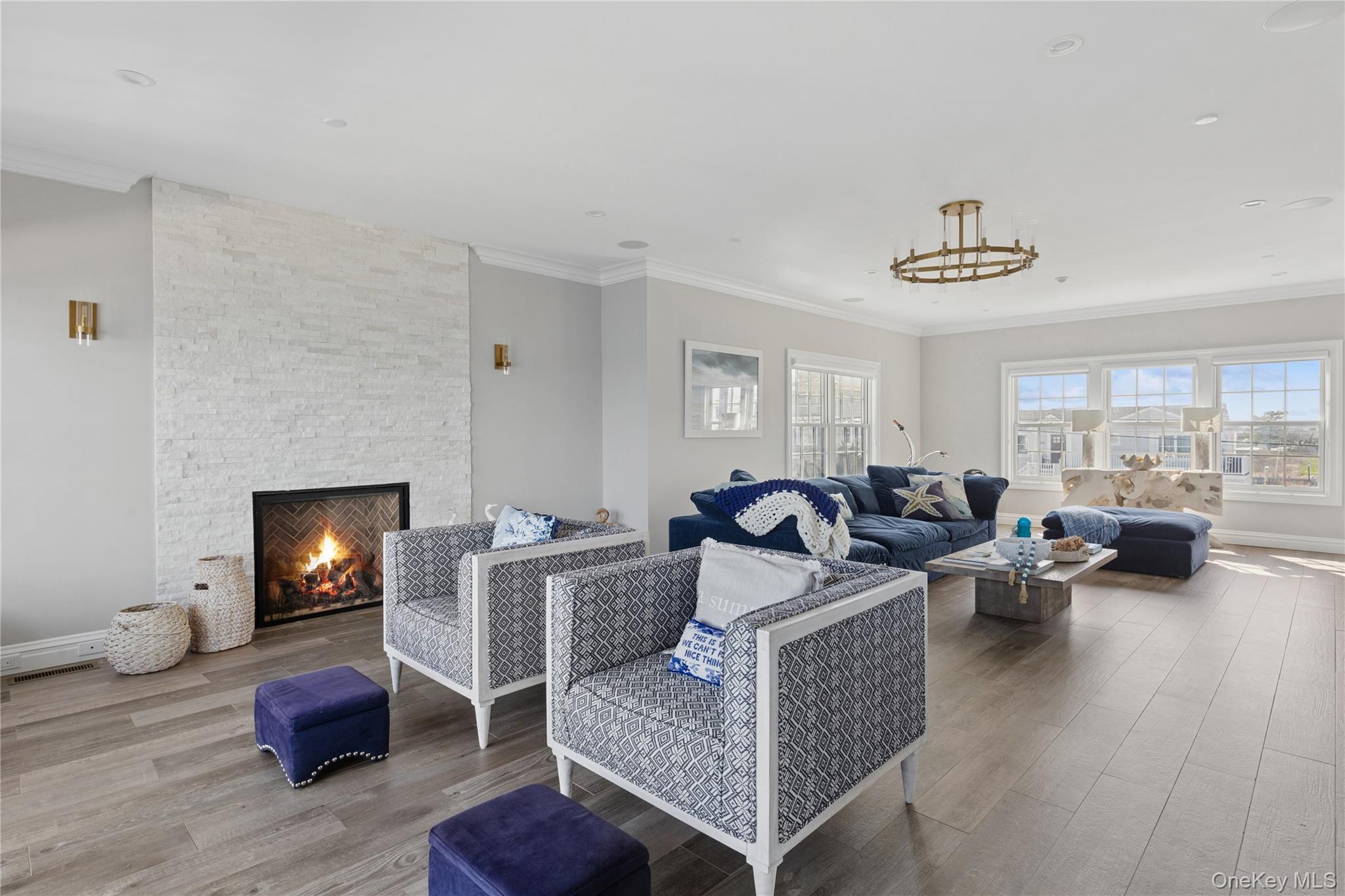 39 Shinnecock Road East Quogue, NY 11942 - Photo 2 of 35 a living room with furniture and a wooden floor