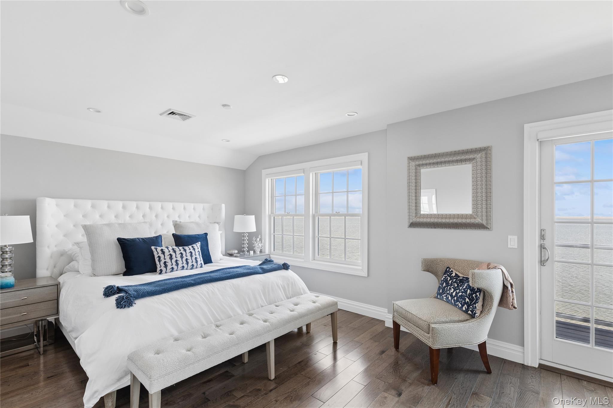 39 Shinnecock Road East Quogue, NY 11942 - Photo 24 of 35 a bedroom with a bed and a couch