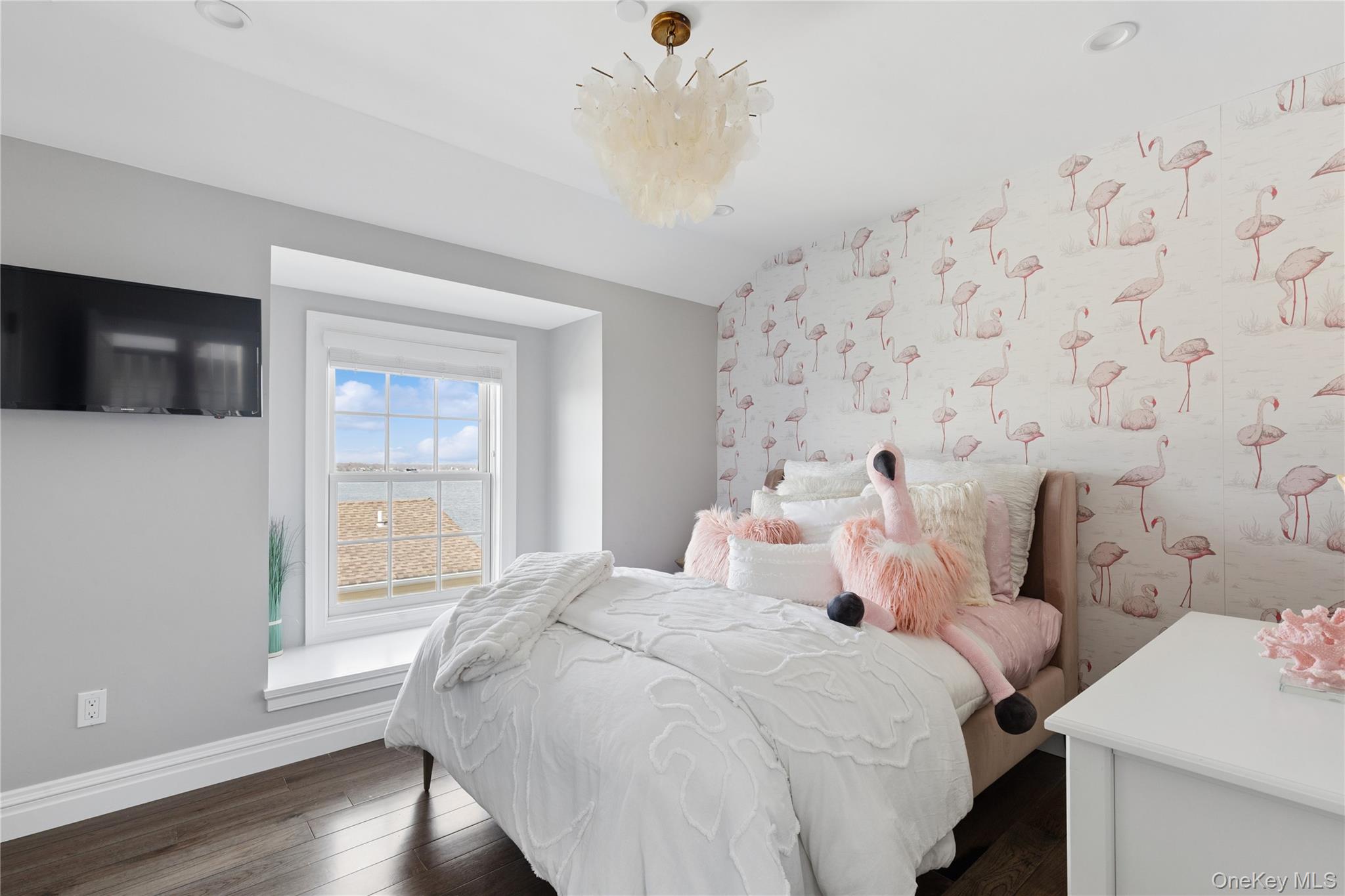 39 Shinnecock Road East Quogue, NY 11942 - Photo 27 of 35 a bedroom with bed and a window
