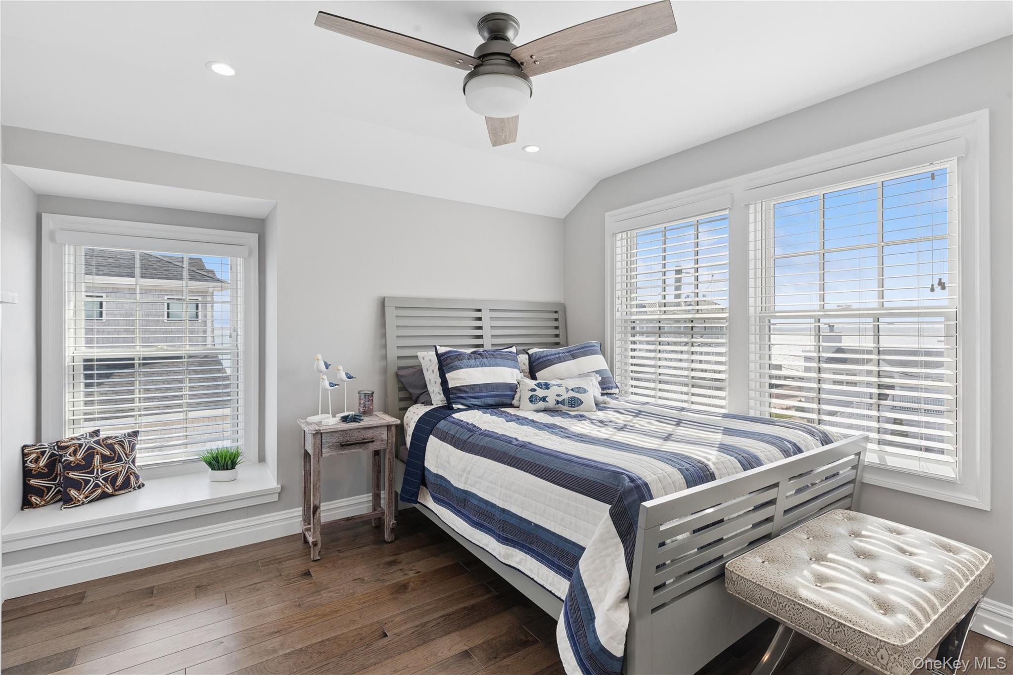 39 Shinnecock Road East Quogue, NY 11942 - Photo 30 of 35 a bedroom with a bed and windows