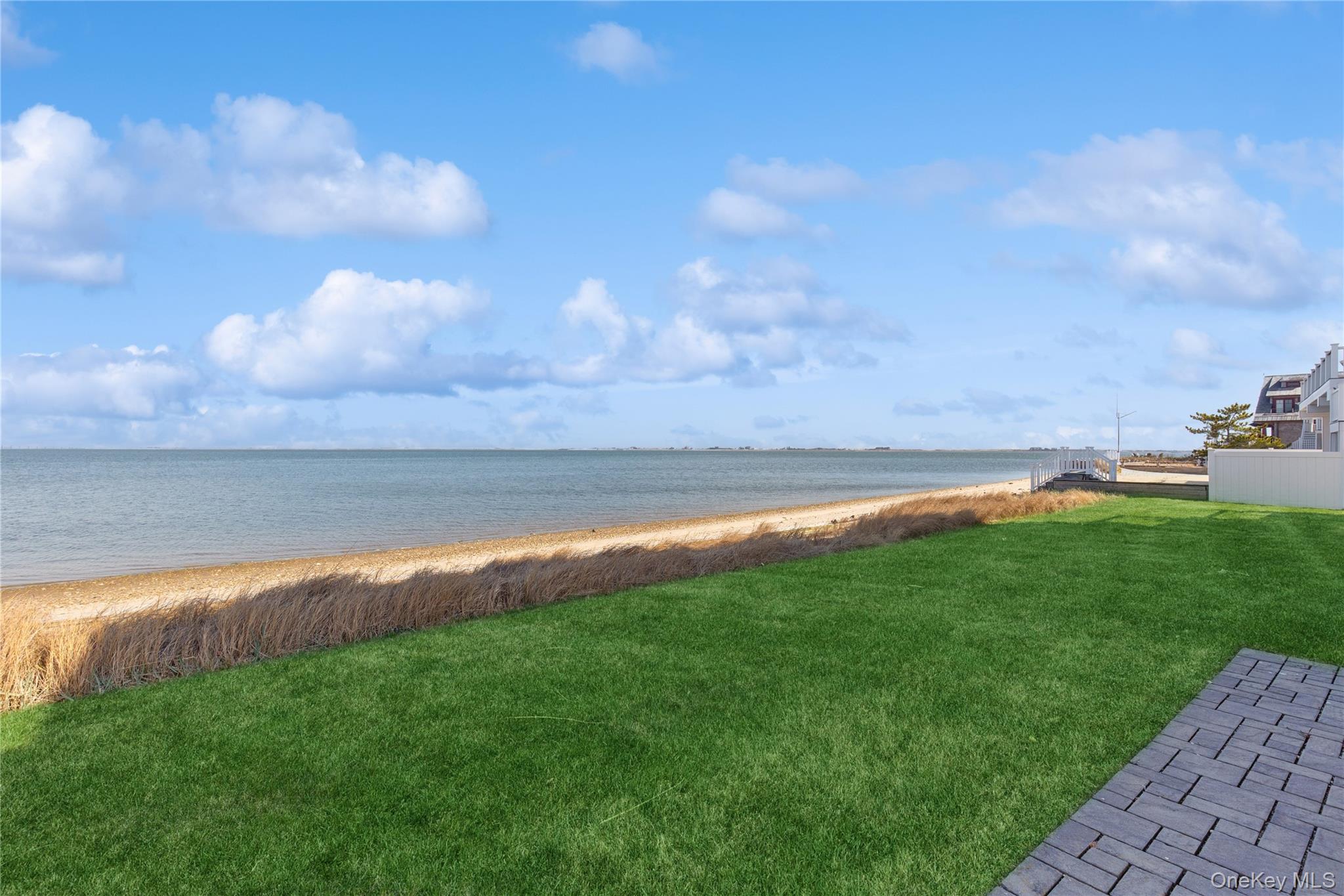 39 Shinnecock Road East Quogue, NY 11942 - Photo 33 of 35 a view of a lake with a big yard