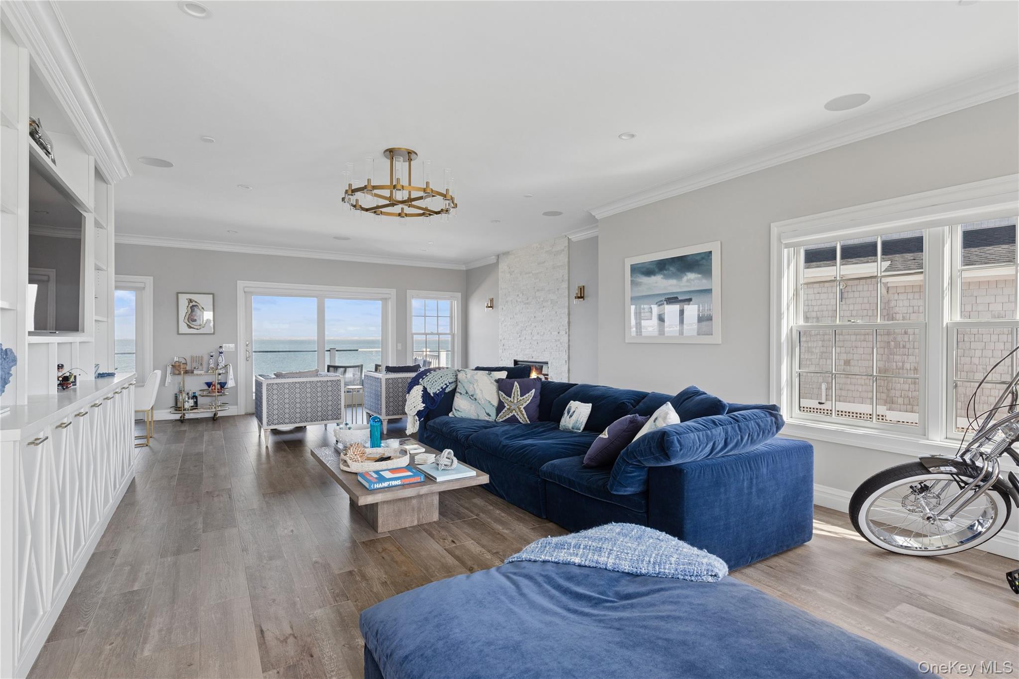 39 Shinnecock Road East Quogue, NY 11942 - Photo 4 of 35 a living room with furniture and a table