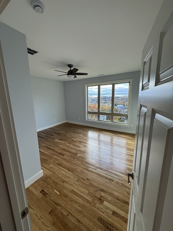 41 Westminster Street Worcester, MA 01605 - Photo 17 of 32 wooden floor in an empty room with a window