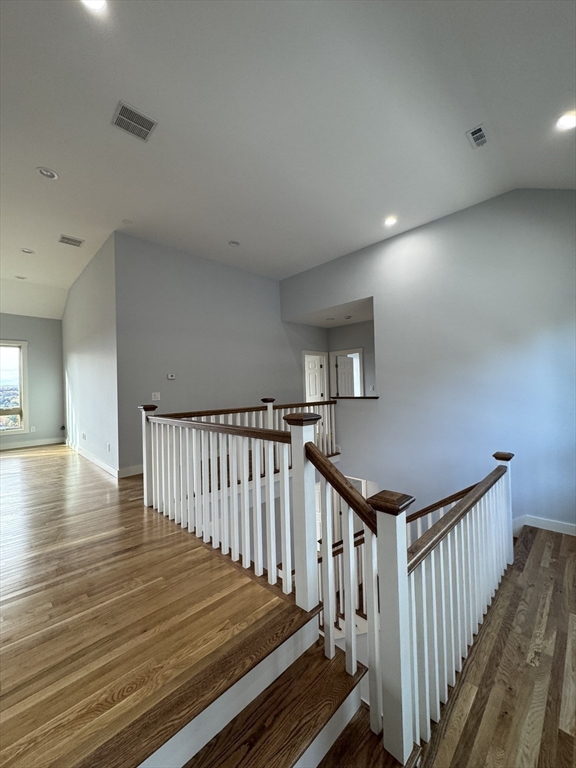 41 Westminster Street Worcester, MA 01605 - Photo 23 of 32 a view of a hallway with wooden floor and stairs