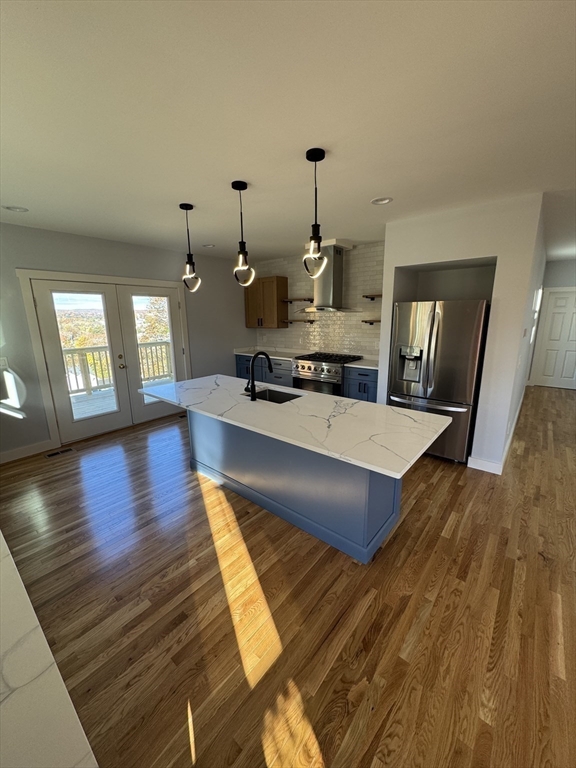 41 Westminster Street Worcester, MA 01605 - Photo 7 of 32 a living room with couch dining table wooden floor and a rug