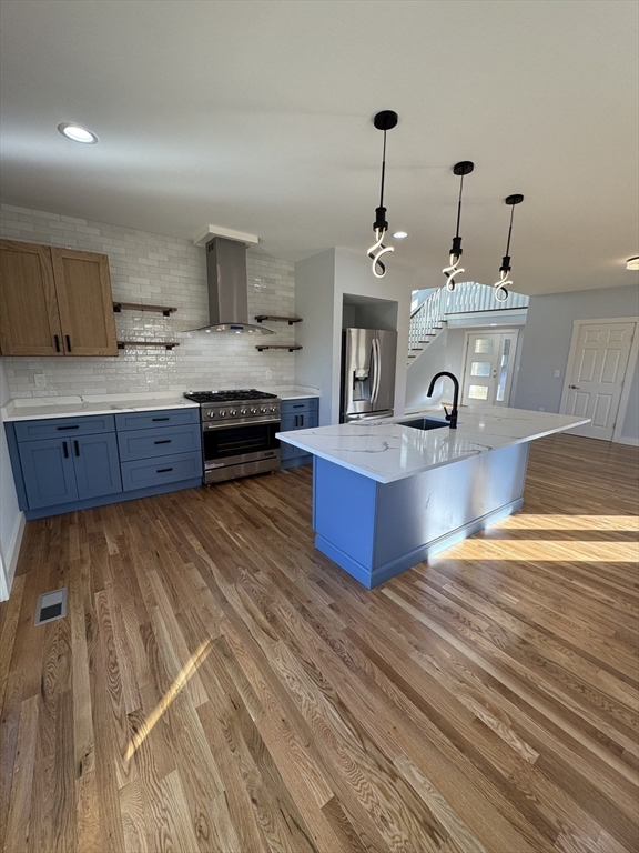 41 Westminster Street Worcester, MA 01605 - Photo 9 of 32 a large kitchen with kitchen island a sink stainless steel appliances and cabinets