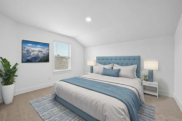 a bedroom with a bed and a flat screen tv in it