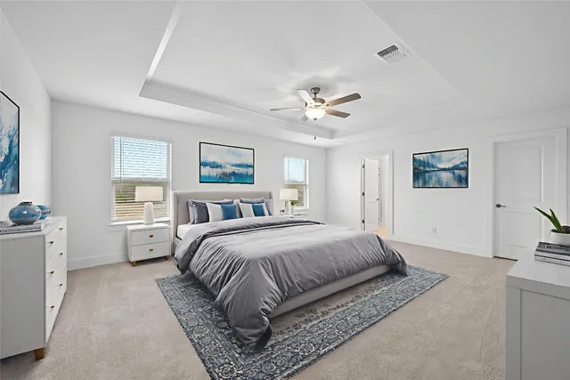 a living room with furniture a chandelier and a glass door