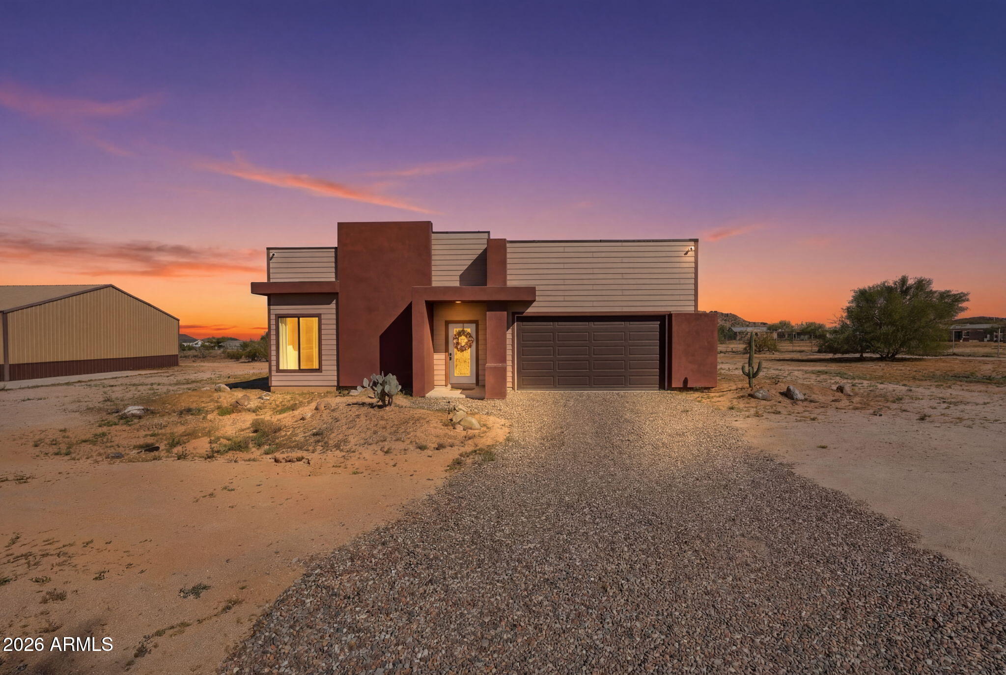 1289 South Oak Road Maricopa, AZ 85139 - Photo 3 of 39 a front view of a house with a yard