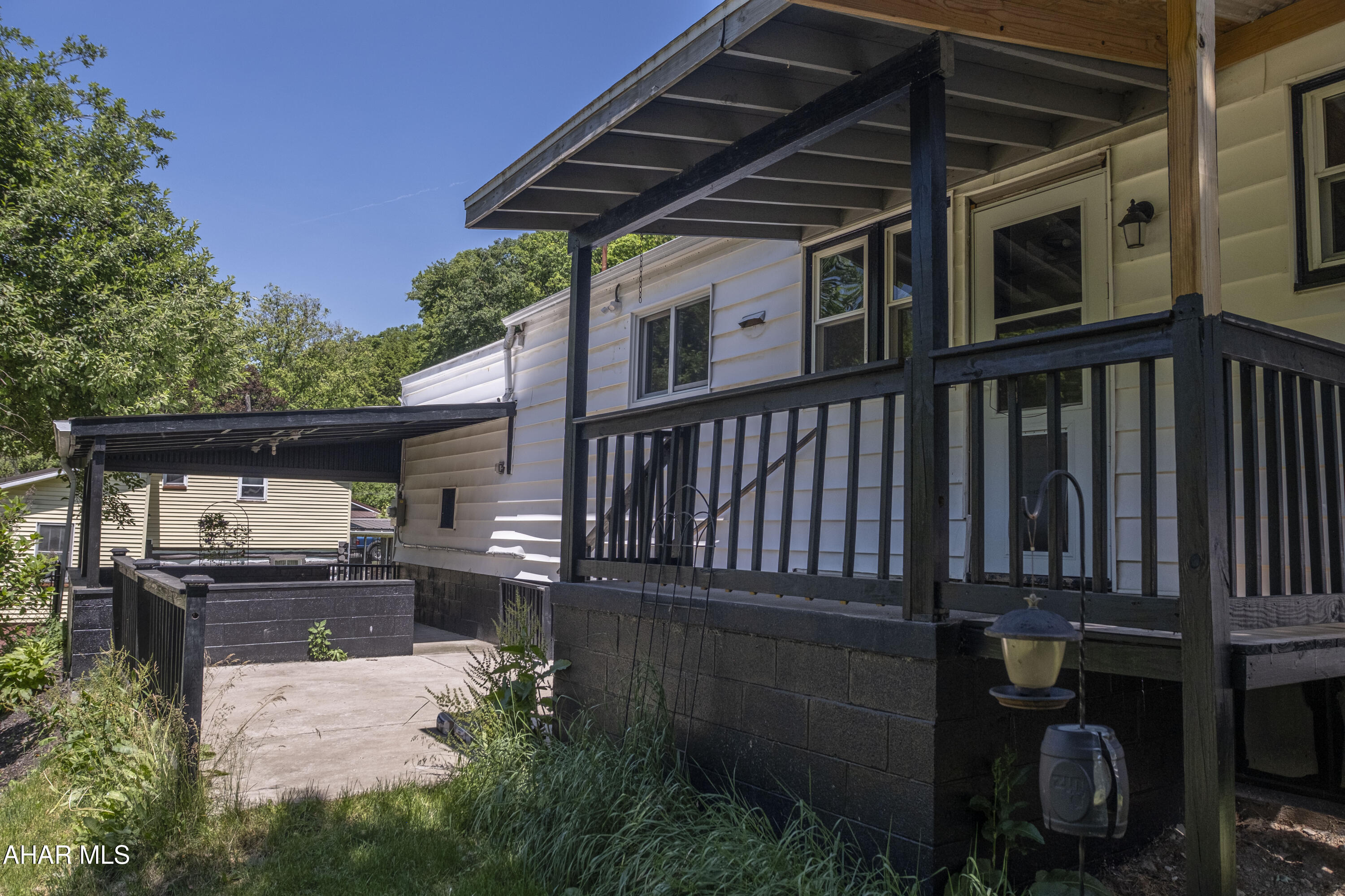871 Decker Hollow Road Tyrone, PA 16686 - Photo 3 of 35 a backyard of a house with barbeque oven and outdoor seating
