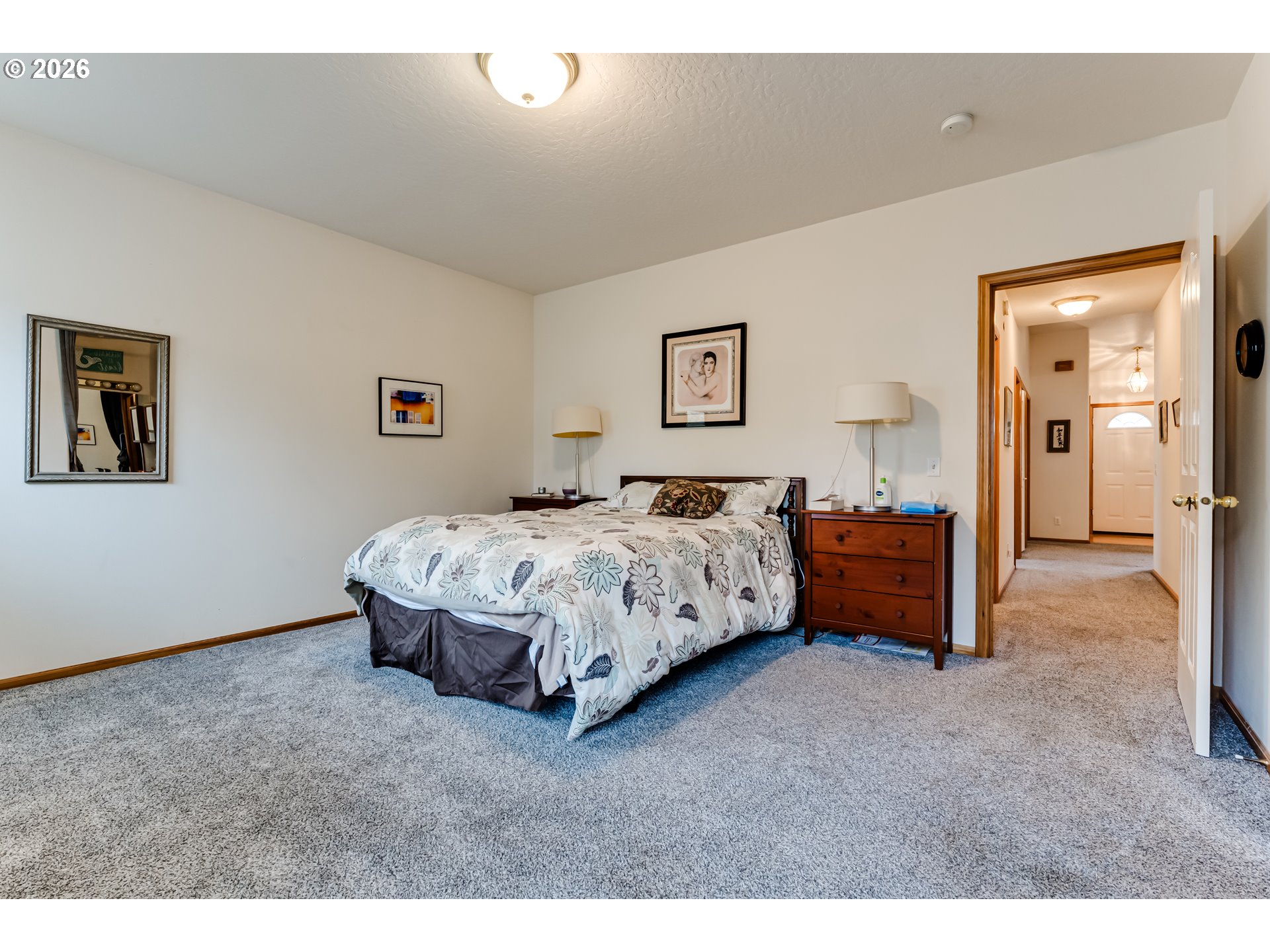 3513 Kendra Street Eugene, OR 97404 - Photo 32 of 45 a bedroom with a bed and a painting